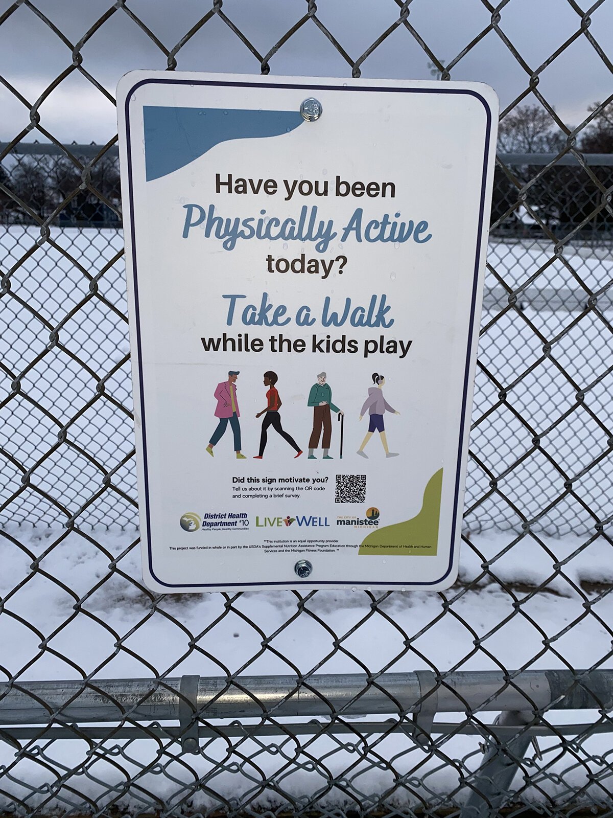 Signage promoting physical activity in Manistee County.