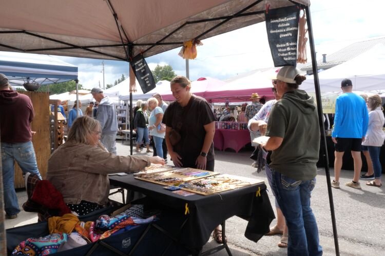 Shoppers with local vendors at the 2024 “Small Town USA Market.”