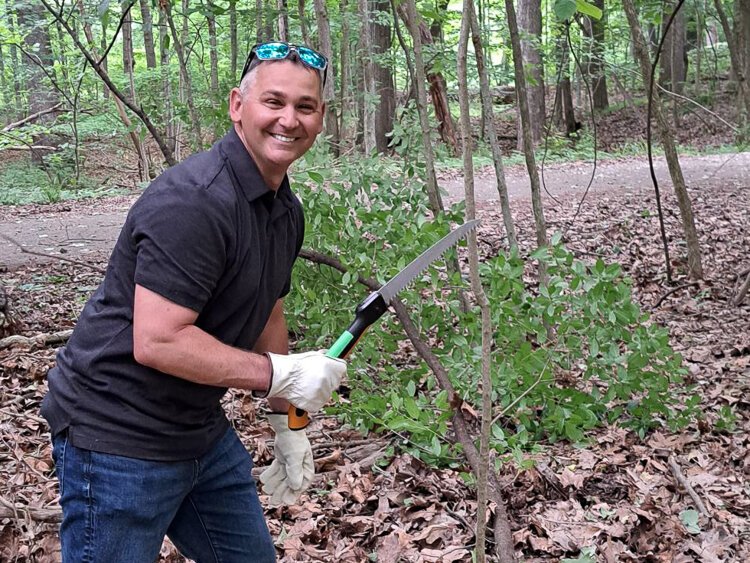 A volunteer helps out at Ken-O-Sha Park.