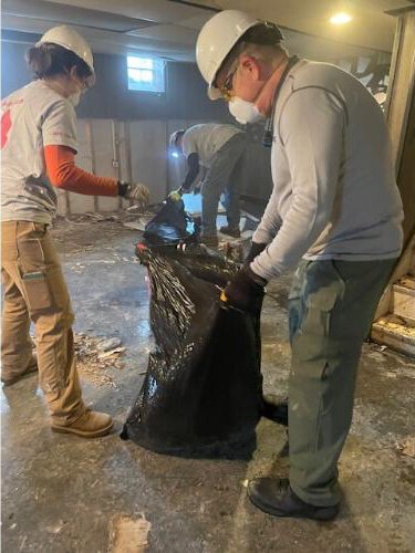 After the Storm volunteers help clean up a home after severe storms.