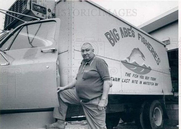 Big Abe LeBlanc in front of the truck he used to deliver fresh fish to customers.