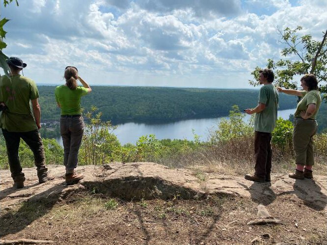 Crew overlooking lake on North Country Trail in the U.P.