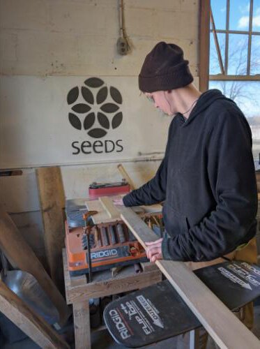 Prepping invasive Black Locust for solar powered boat decking.
