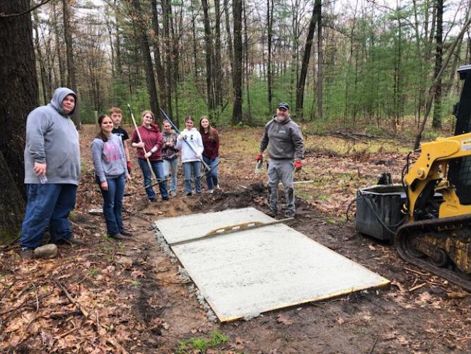 Students also helped pour cement.