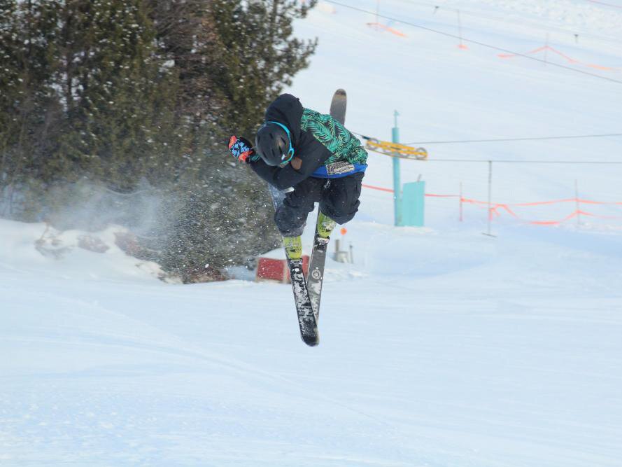 A skier at Mont Ripley. Winter sports like skiing and snowmobiling attract tourists to the region. 