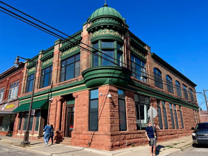 The stately Manistique Bank building was constructed in the early 20th century.