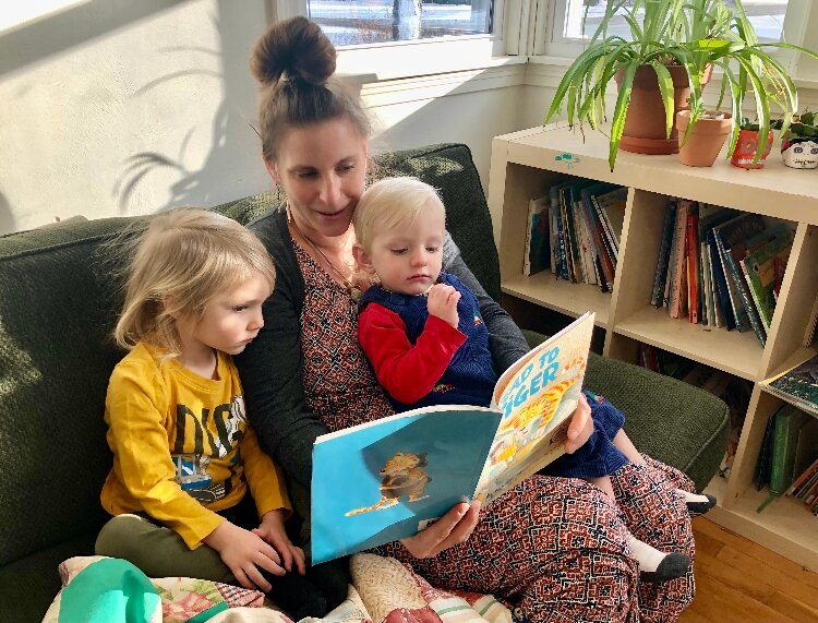 Serena Pawloski reads Tiger to Jericho, 3, and Edison, 1,.