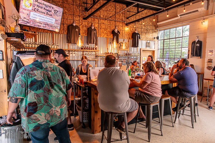 Customers at the River Raisin Distillery in Manchester.