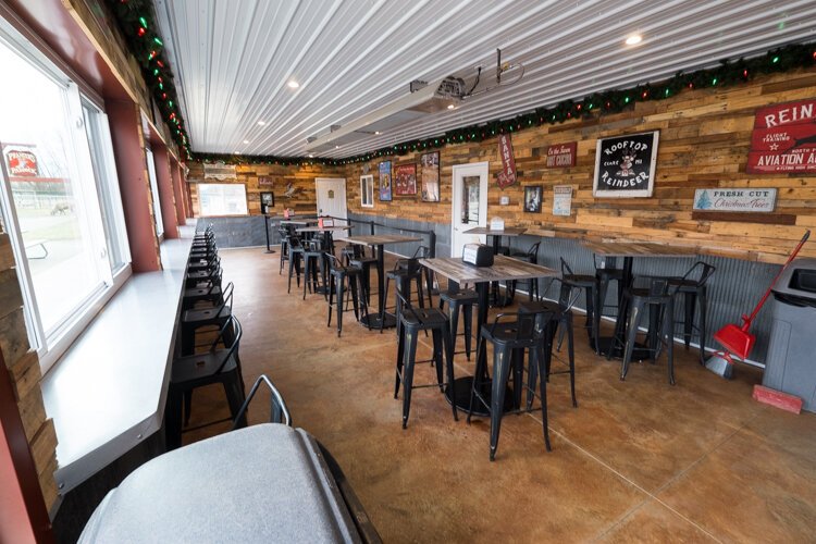 A heated patio in one of the buildings at Rooftop Landing Reindeer Farm offers visitors a warm place to relax.