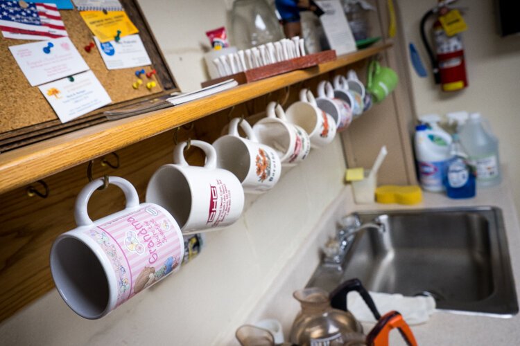 Coffee cups hang on the walls in the Citizens Coffee Room in the Harbor Beach Community House.