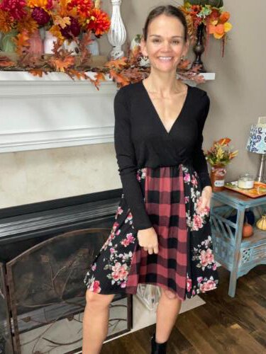 Charina Dellar modeling a plaid and floral dress.