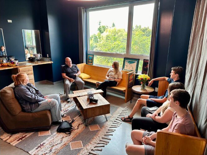 Students gather in the green room at The Alluvion. 