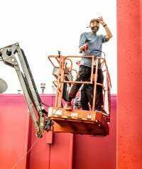 Detroit artist Rick Williams working on a mural.