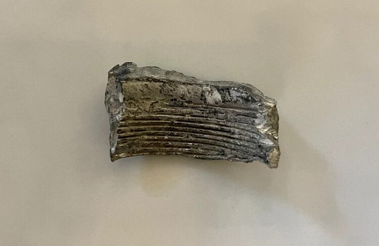 Comtois served seven deployments, including three tours in Iraq. He brought this piece of a mortar round home from Iraq.