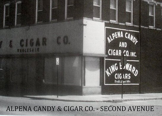 A historic photo of the theater building in an earlier incarnation as a business.