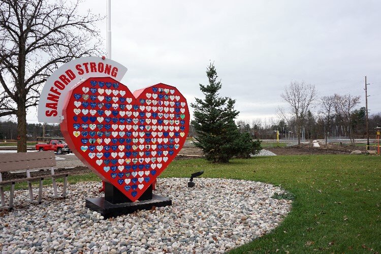  The Sanford Strong heart sculpture stands near the park’s new entrance. It honors the community devastated by the flood.