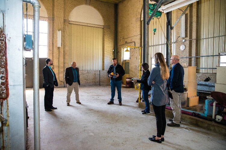 Representatives from Bay Future, RiversEdge Development, and Bangor Township are taking potential developers through the building, located next to Bay City State Park.