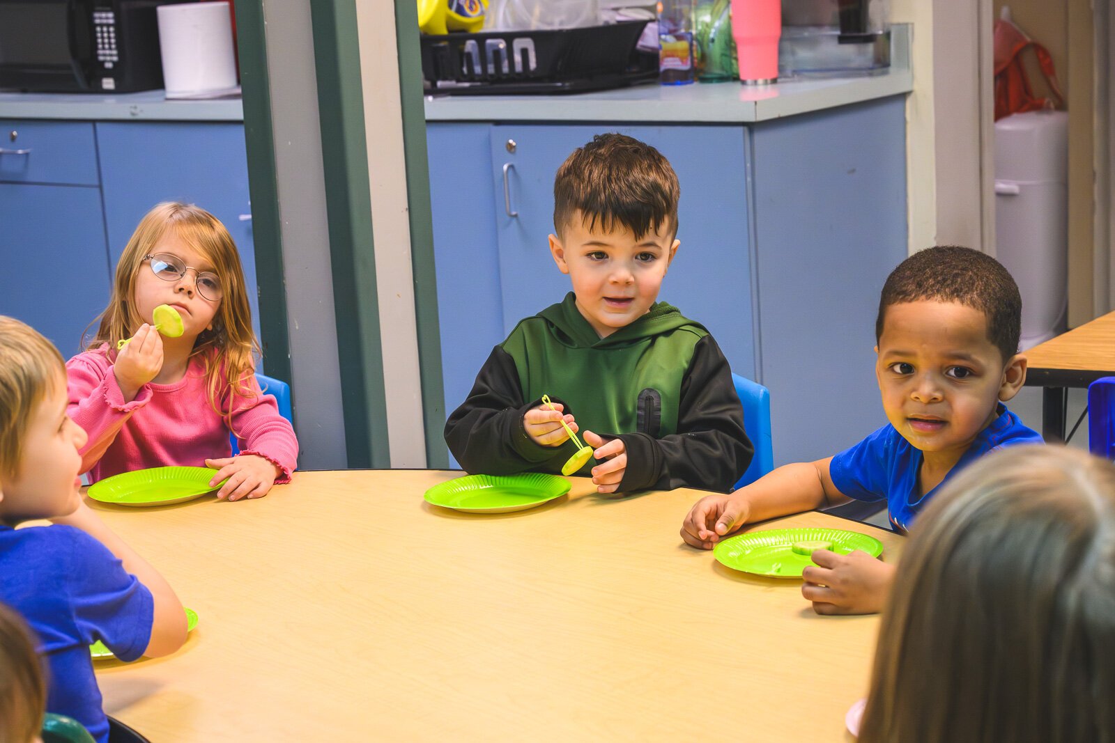 Head Start students at St. John's Universal Church of Christ in Jackson learn about cucumbers and dragonfruit in a lesson on mindful eating.