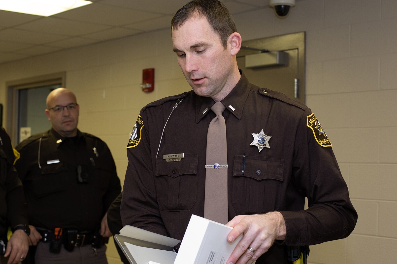 Sanilac County Sheriff's Office Sergeant Michael Moore opens his new iPad