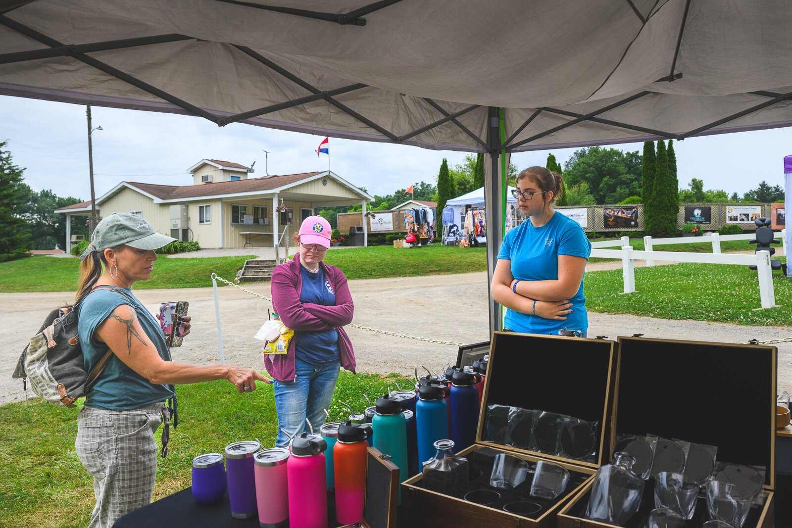 Manchester Entrepreneurial STEM student Annalies Walsh selling merchandise at Waterloo Hunt Club in Grass Lake.