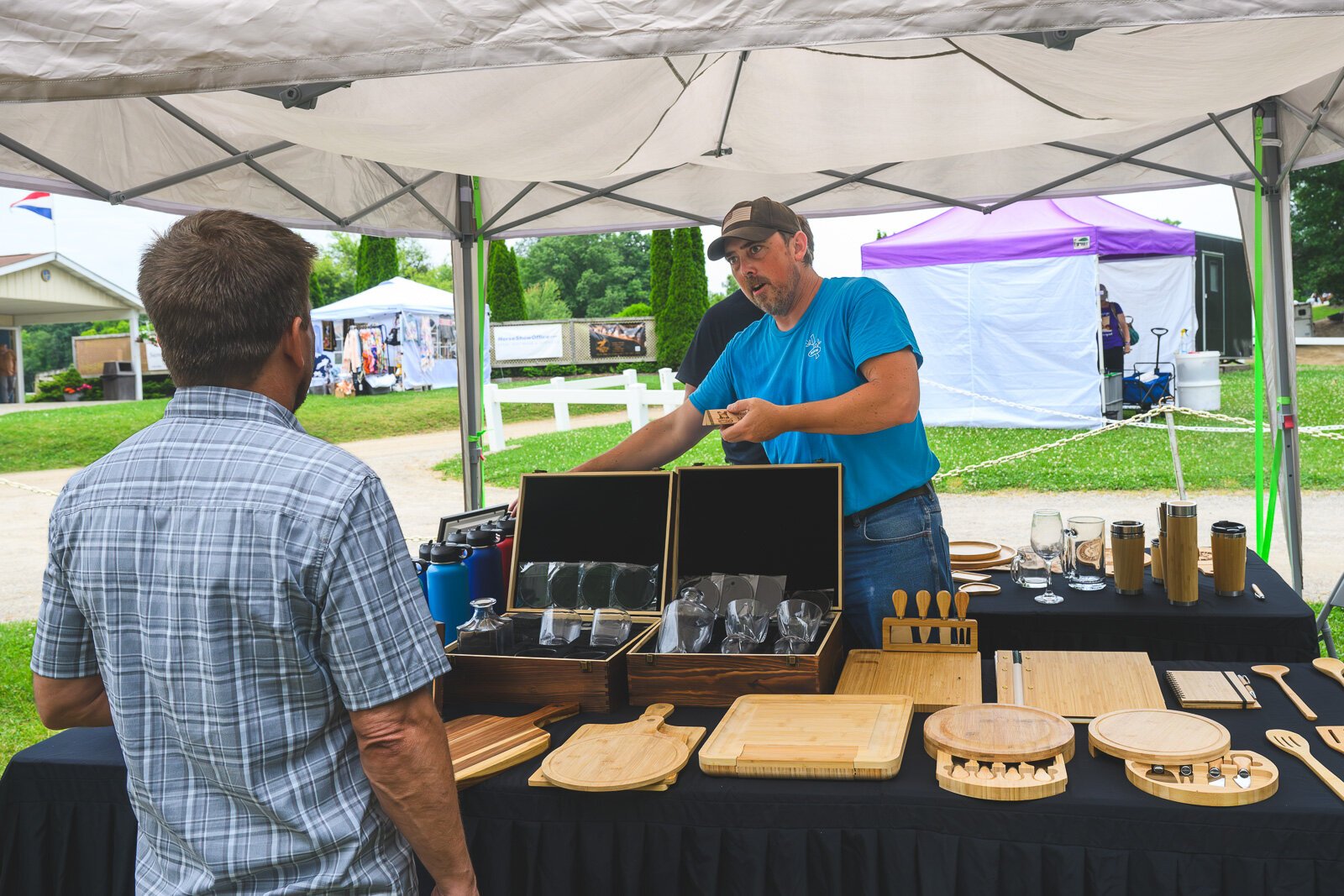 Joe Walsh selling Manchester Entrepreneurial STEM merchandise at Waterloo Hunt Club in Grass Lake.