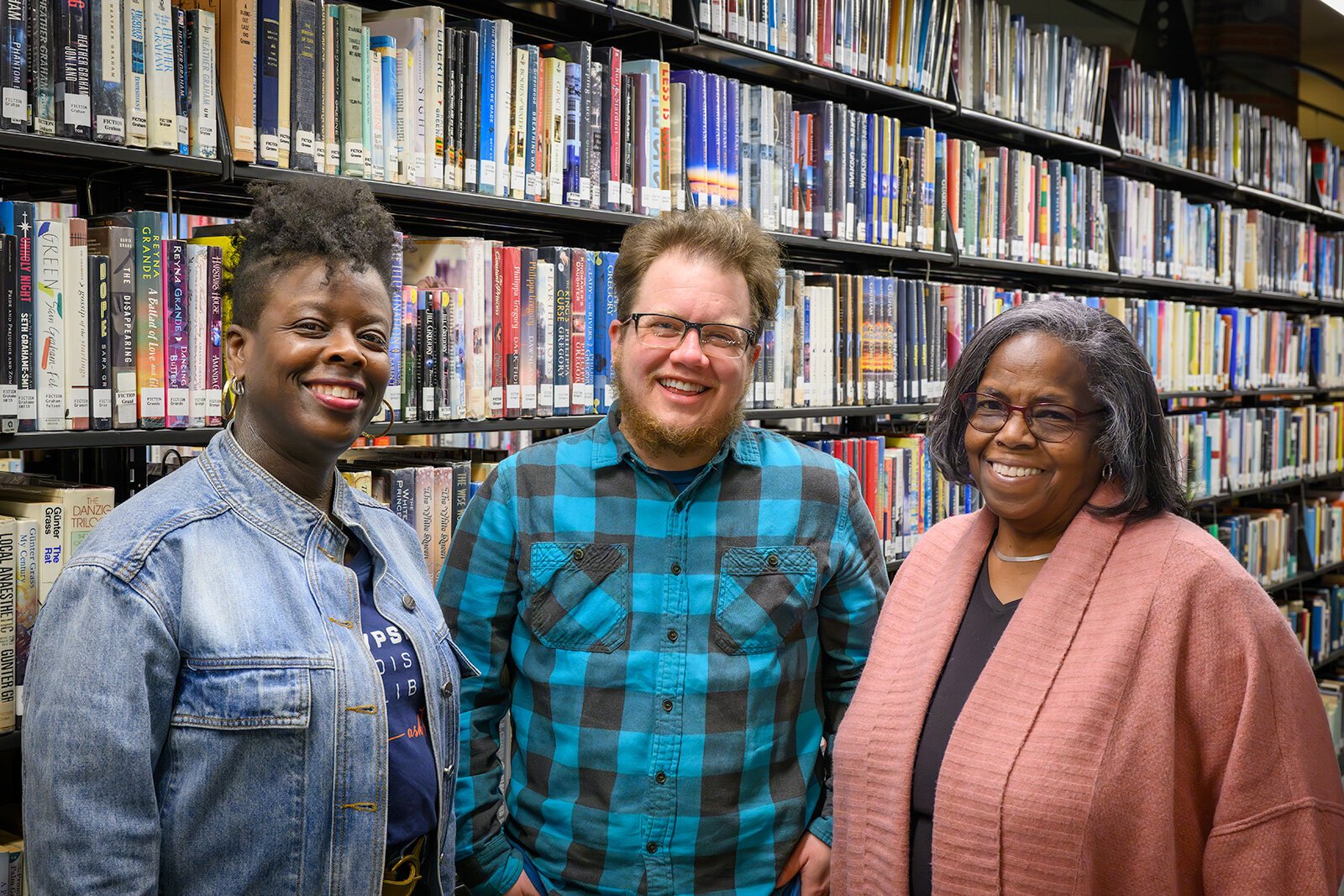 Amisha Harijan, Finn Bell, and Omer Jean Winborn at the YDL Whittaker Road branch.