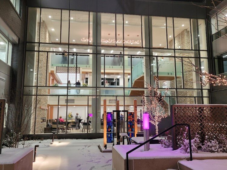 A stained glass sculpture in the courtyard honors late CEO Diane Postler-Slattery.