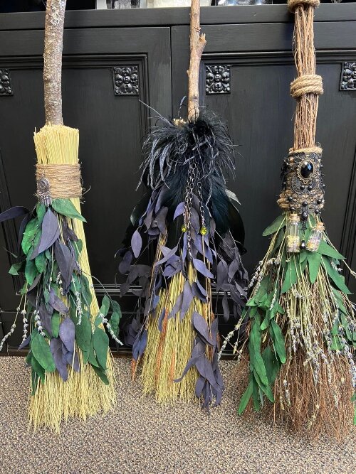 The shop carries handmade items, such as these decorative brooms.