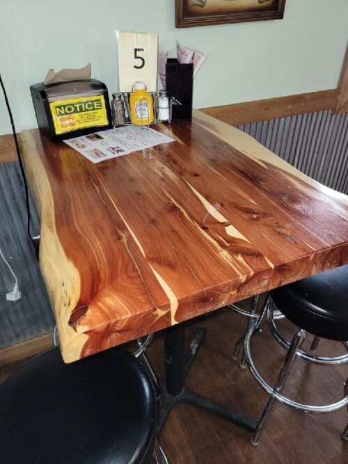 Inside the restaurant, you'll find unique tables and a family atmosphere.