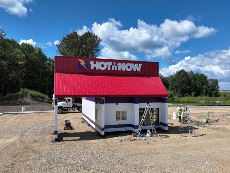A modular Hot 'n Now arrived in Wayland by truck and placed down by crane.