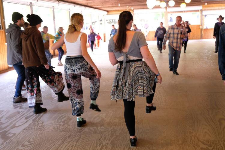Festival goers practice clogging at last year's event.