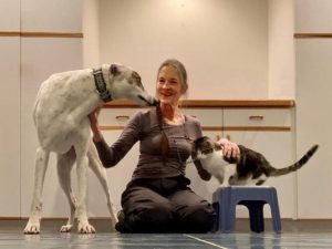 Anna Taylor shares affection with retired racing greyhounds that she fostered in her home in Traverse City. She has served as a foster through Greyhound Retirement Adoption Care and Education.
