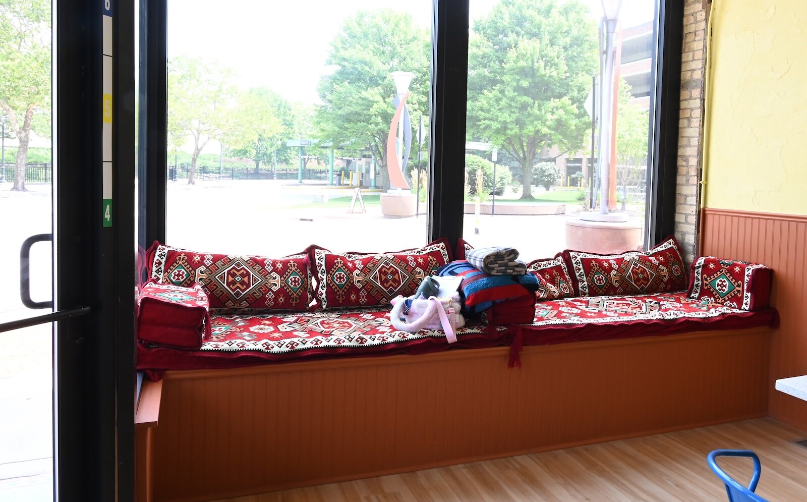 Looking out from two windows inside the Uproot Market and Eatery toward West Michigan Avenue